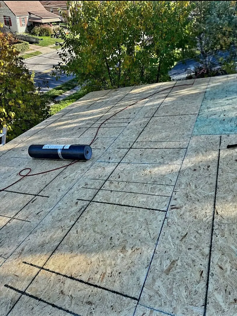 Fresh roof decking with underlayment roll ready for shingles